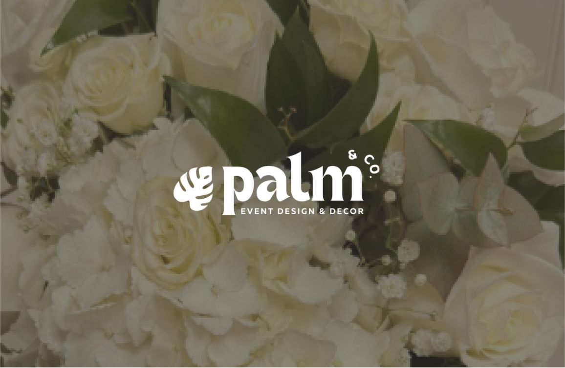 White floral arrangement with the Palm and Co. Event Design mark