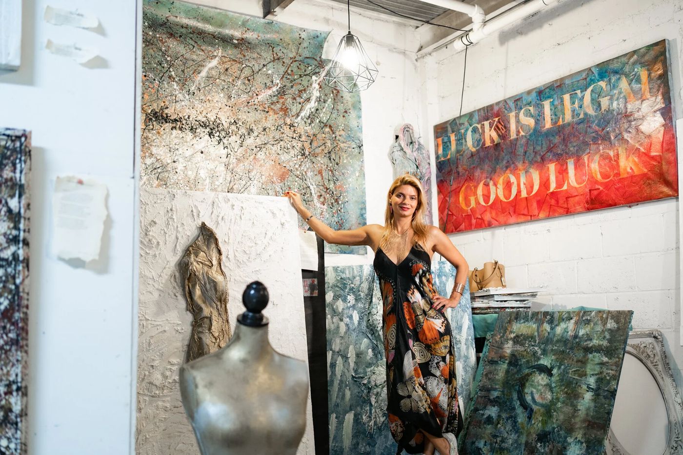 Polen Cerci in her Miami studio surrounded by her paintings