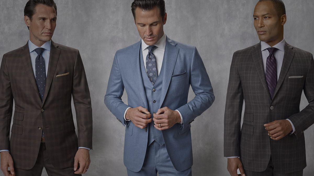 Three men in tailored Tom James suits